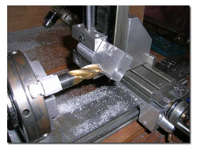 Radiusing the bottom of the base manually to match the cylinder. This required several passes at a few degrees interval. Radiusing the bottom of the base manually to match the cylinder. This required several passes at a few degrees interval.